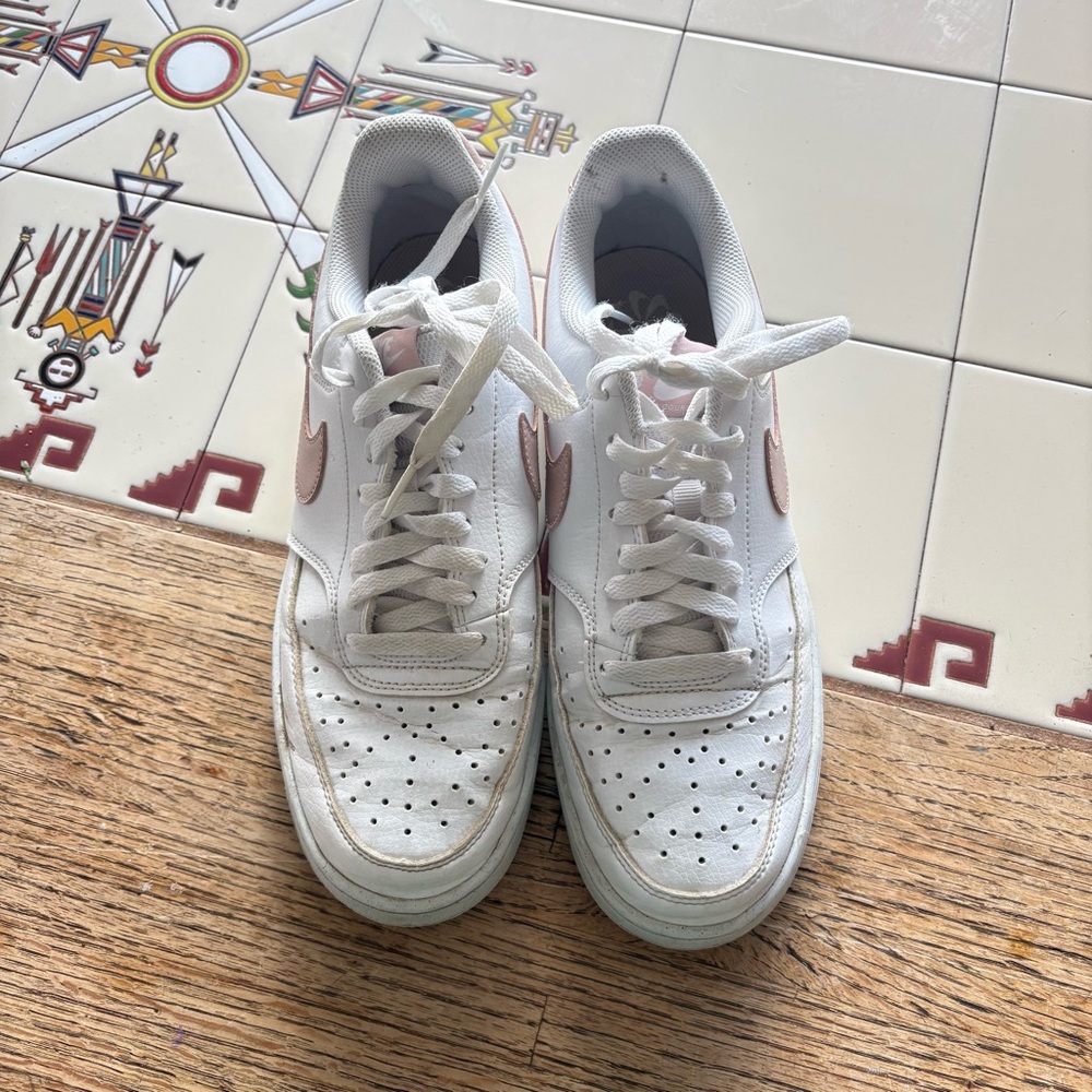 Nike White Low-Top Sneakers with Pink Swoosh Accent